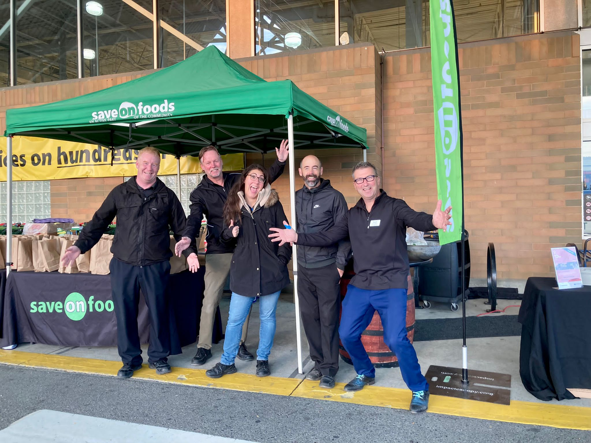 Scott Nazaruk (far right) and his team at the Orchard Plaza Save-On-Foods with big smiles and big hearts on Better Together Day. 