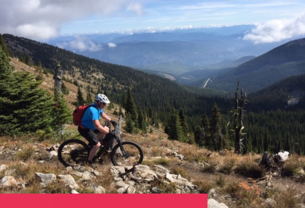 Man mountain biking in the Okanagan valley with red block overlay